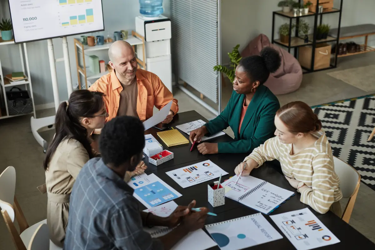 Business Team Meeting At Table discussing company budget