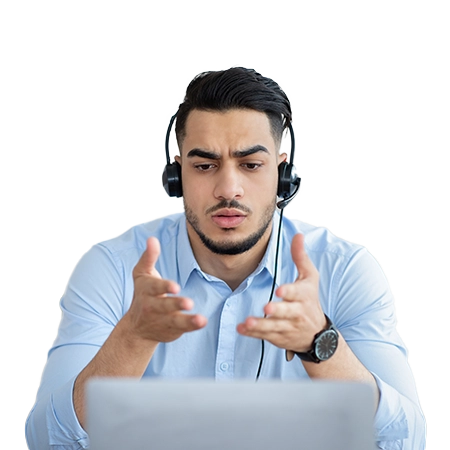 Man talking on a headset using a laptop