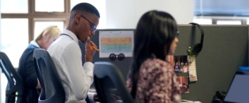 Shot of businesspeople working in an office.